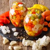 pickled vegetables on a wood counter