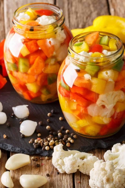 pickled vegetables on a wood counter