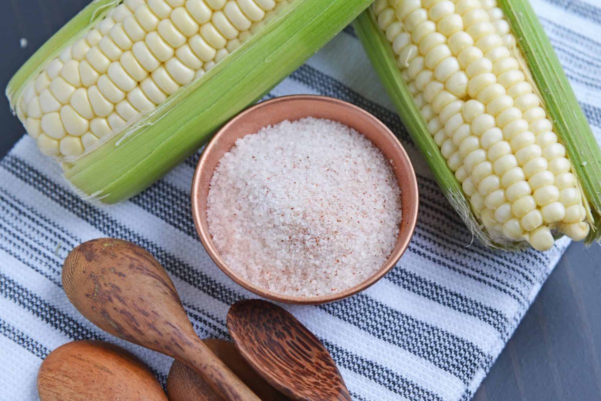 corn on the cob seasoning in a copper bowl 