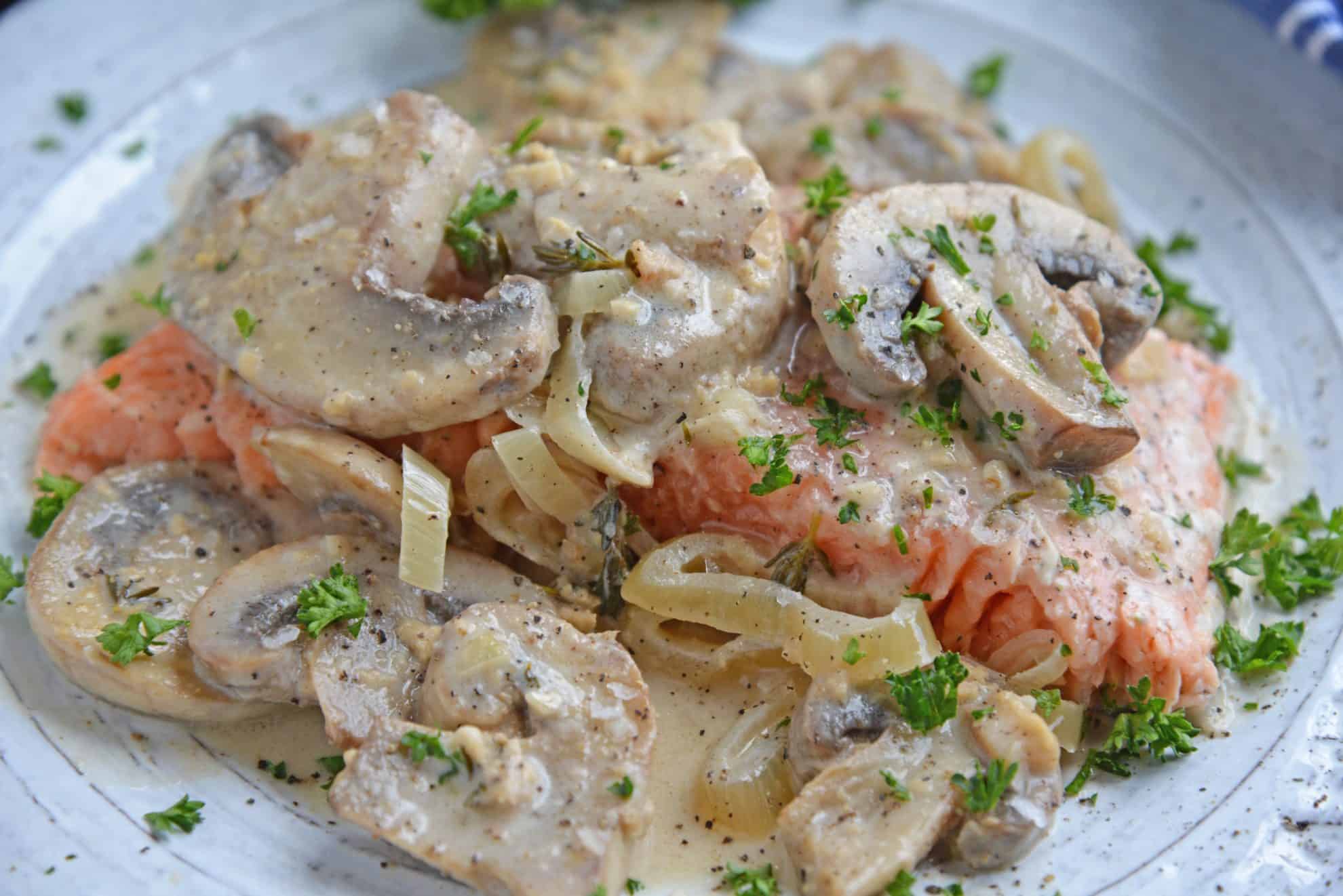 Side view of salmon in creamy sauce
