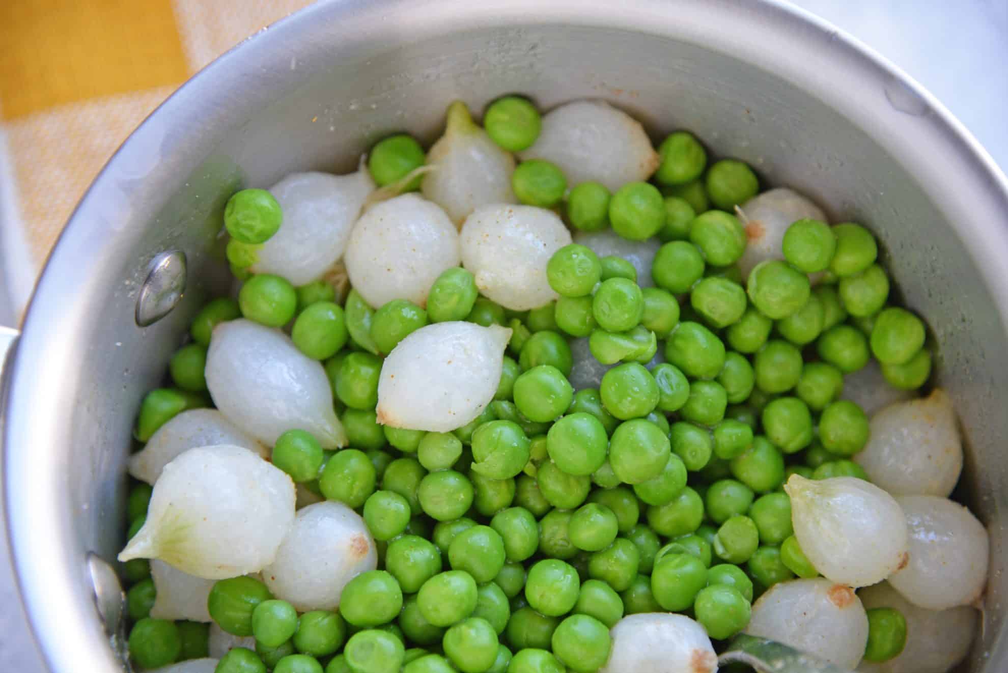 peas and onions in saucepan