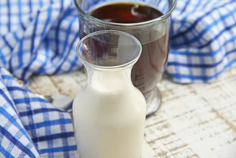 Homemade coffee creamer with cup of coffee