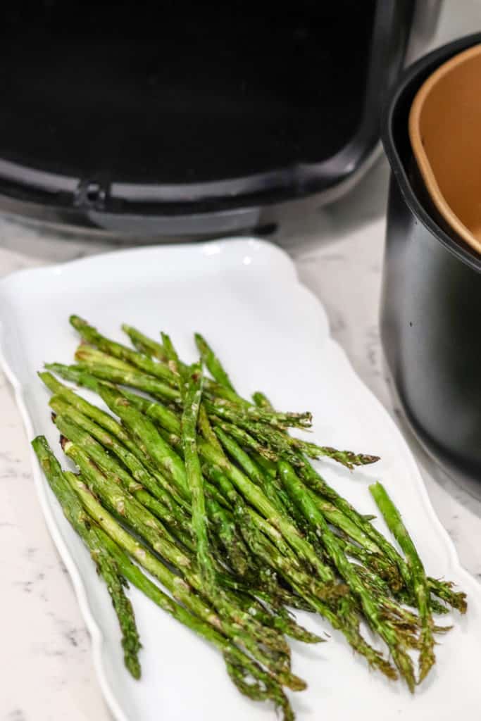 Air fryer asparagus on a white plate