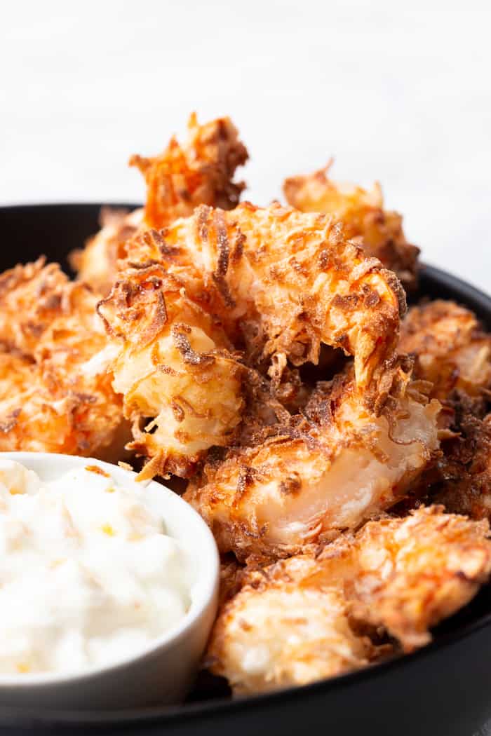 Close up of coconut fried shrimp with sauce