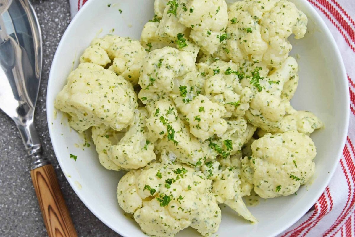 Green Curry Cauliflower in a white serving bowl 