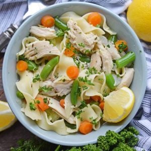 Overhead shot of chicken noodle soup in a bowl