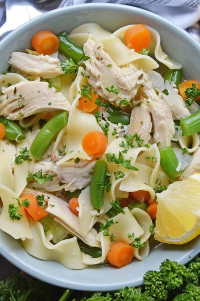 Overhead shot of chicken noodle soup in a bowl