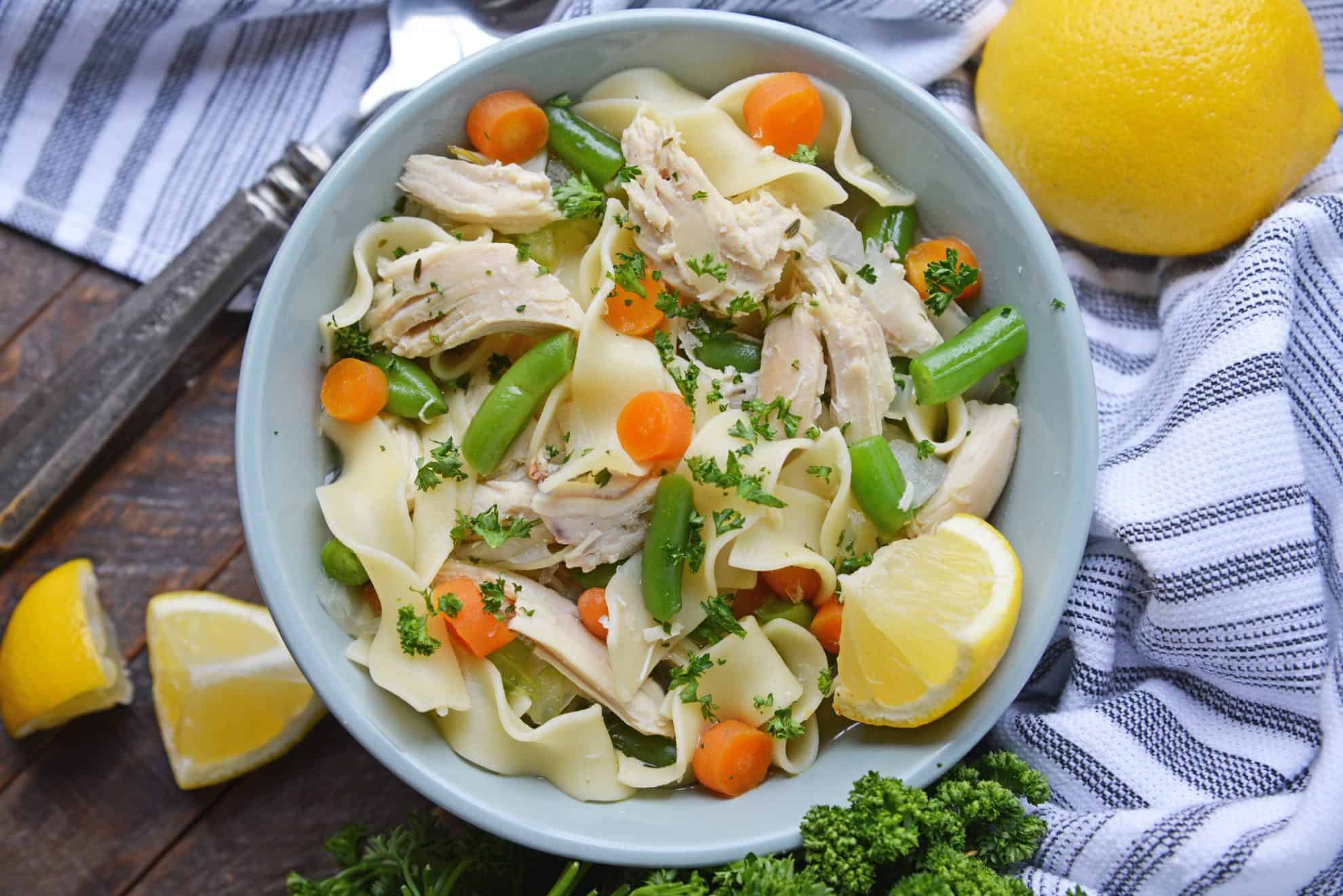 Overhead shot of chicken noodle soup in a bowl