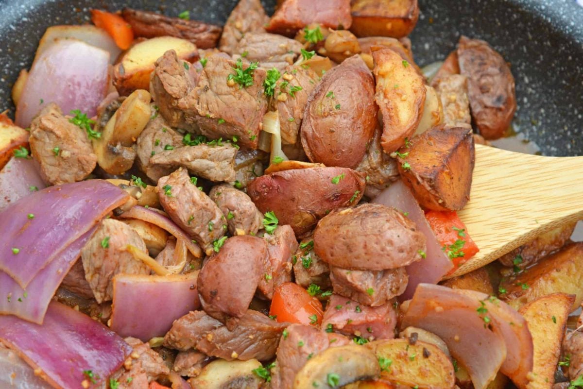 CLose up of steak stir fry in a skillet 