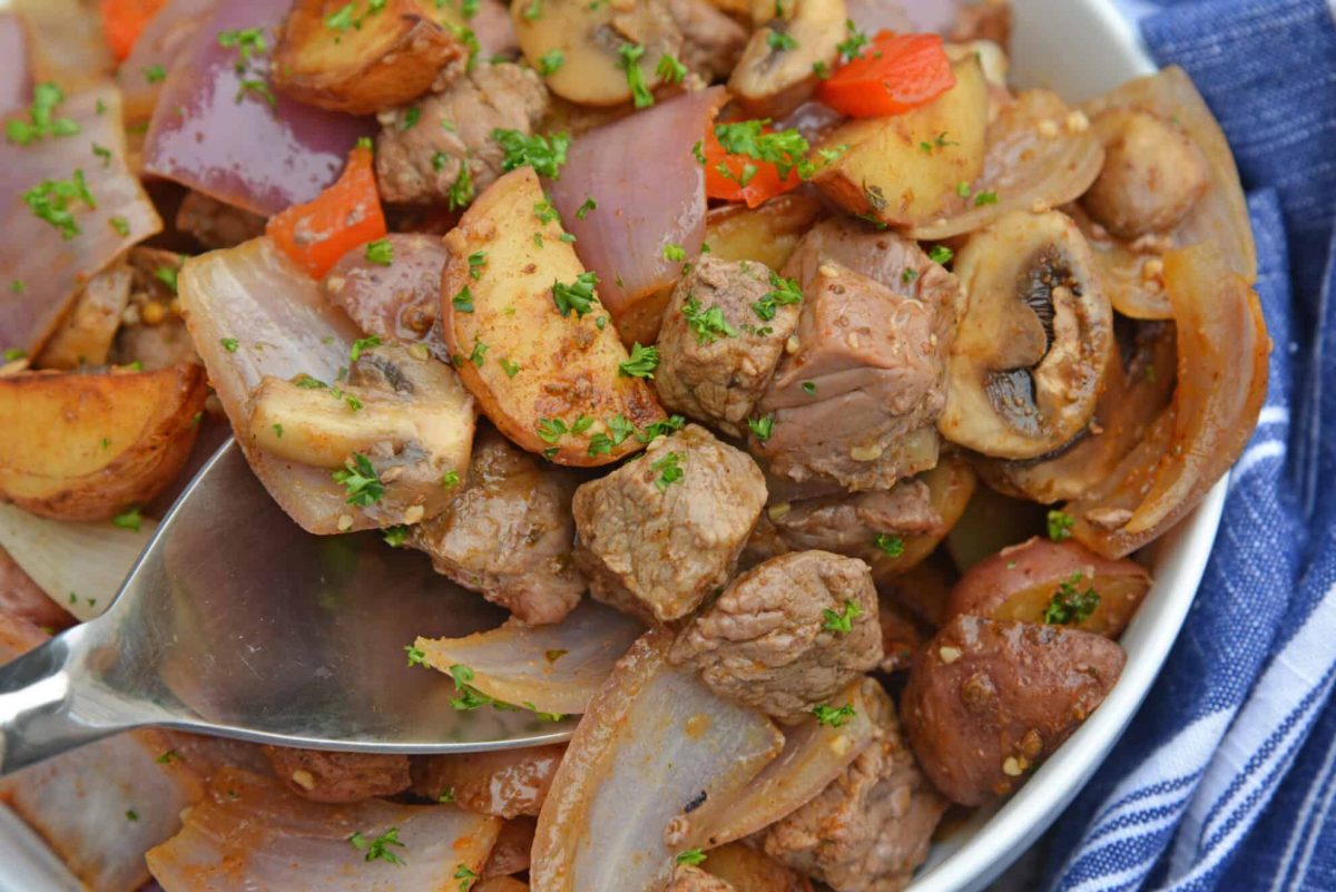 Close up of steak stir fry in a spoon 