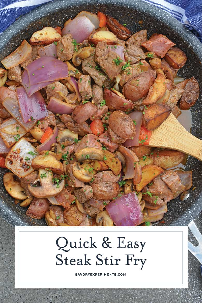 Steak stir fry with a wooden spoon 