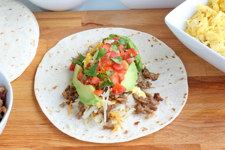 Open face breakfast burrito with avocado, cilantro 