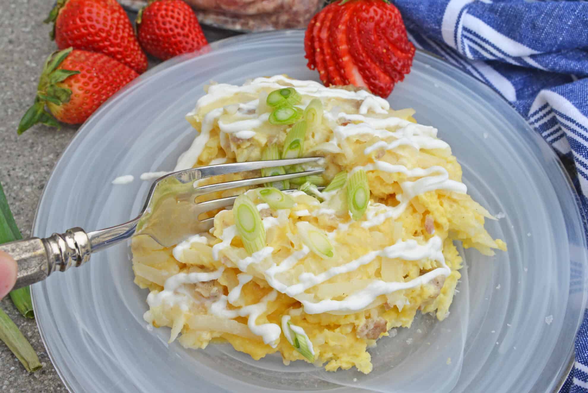 fork digging into breakfast casserole