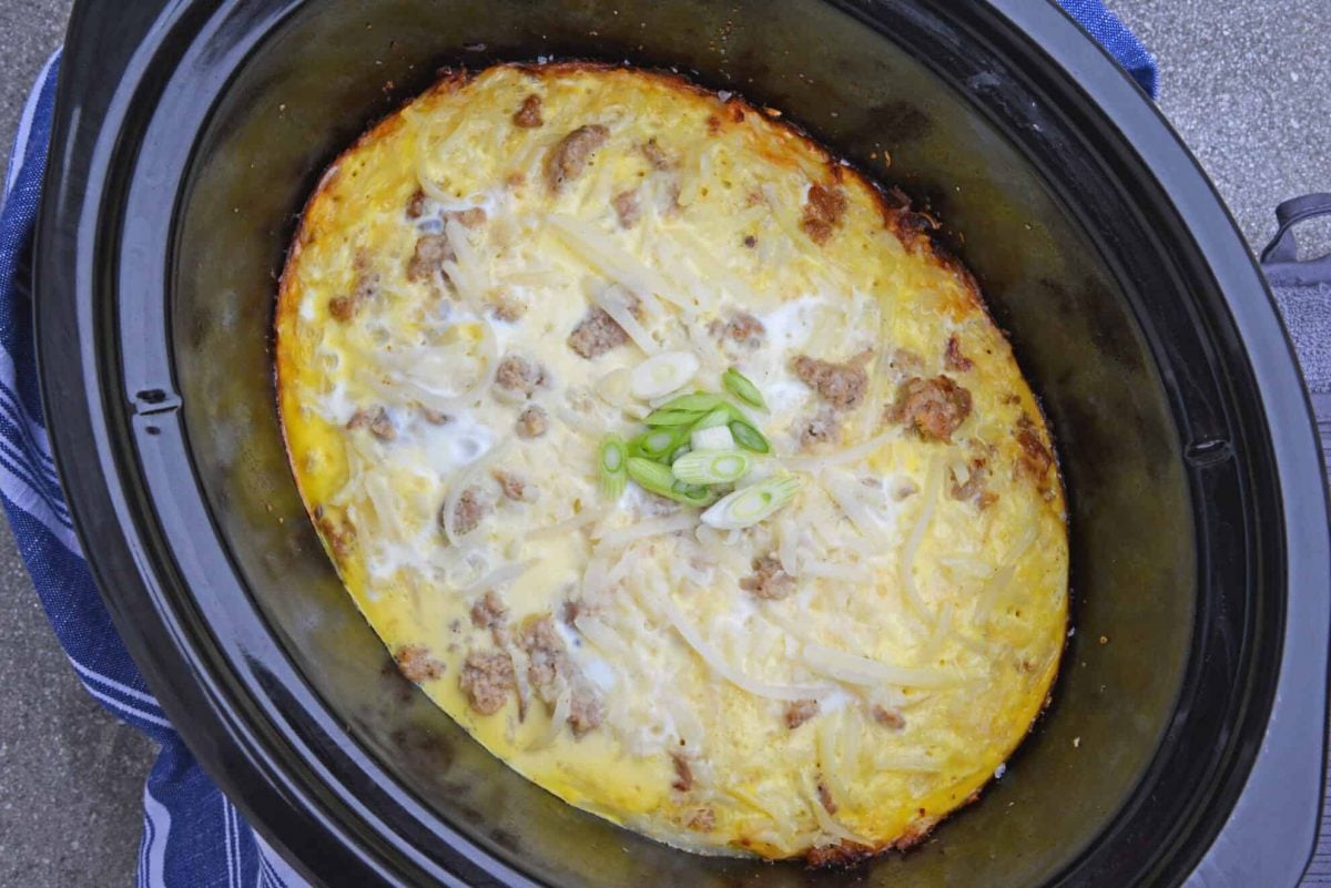 Overhead of breakfast casserole in a slow cooker with melted cheese 