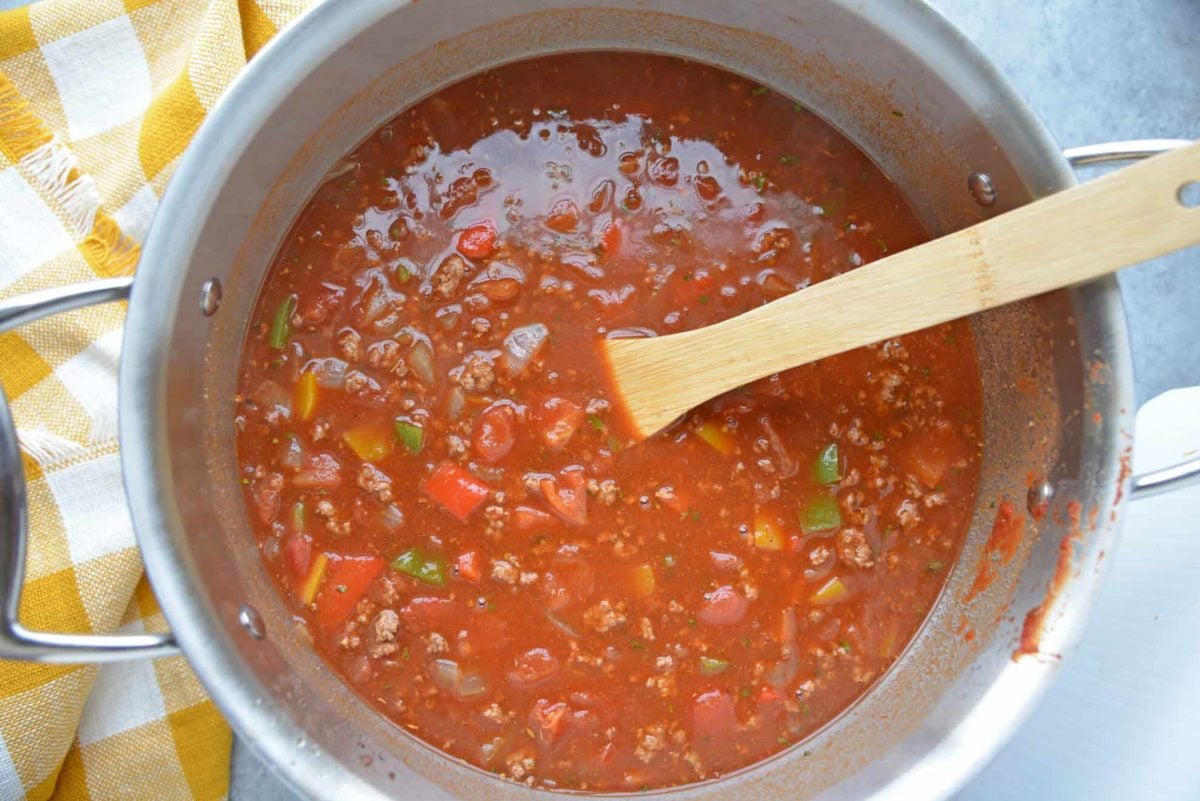beef goulash tomato sauce in a stainless steel pot