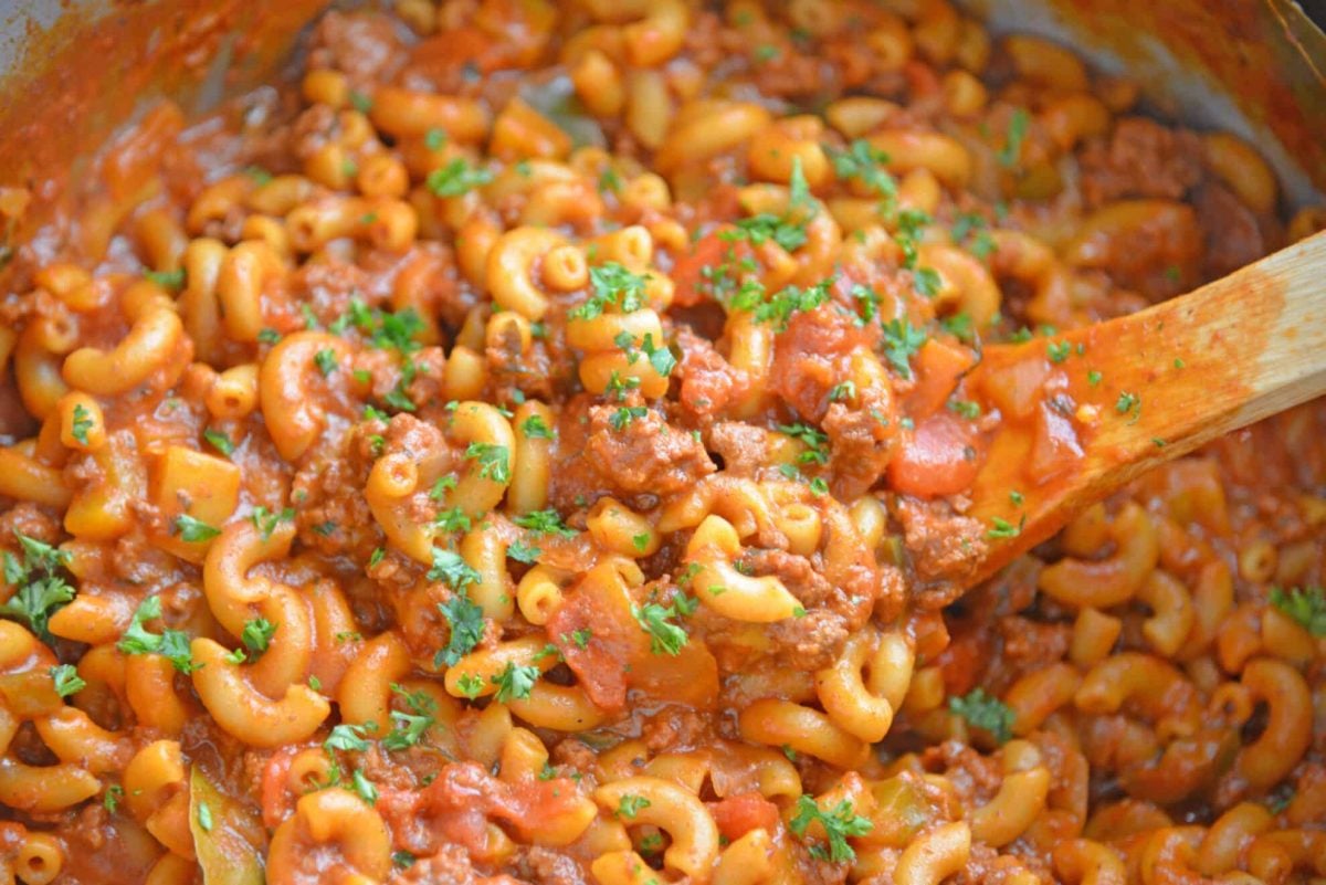 Wooden spoon in a pot of American goulash