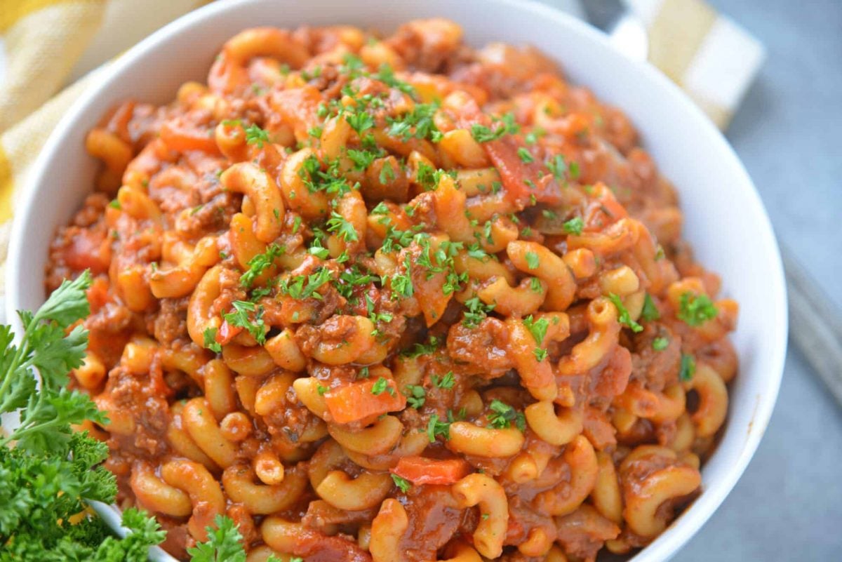 Angle view of American goulash in a white serving bowl 