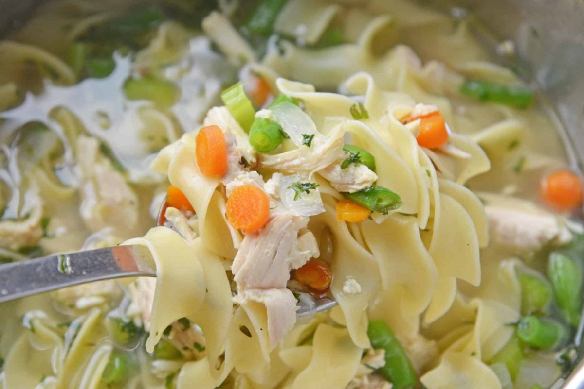 Ladle of homemade chicken noodle soup