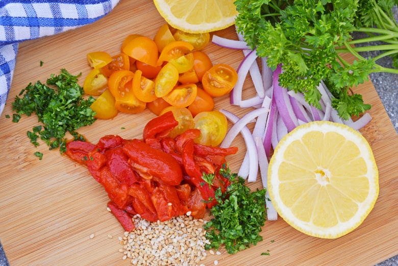 Chopped up ingredients for vegetable flatbreads. 