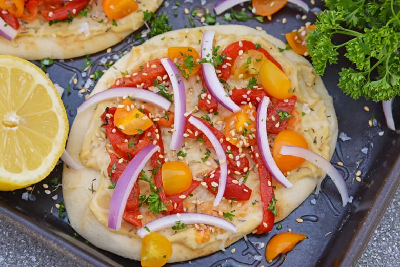 Vegetable flatbread pizza on a baking sheet 