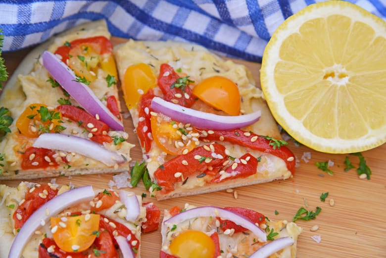 Small vegetable flatbread cut into fourths. 