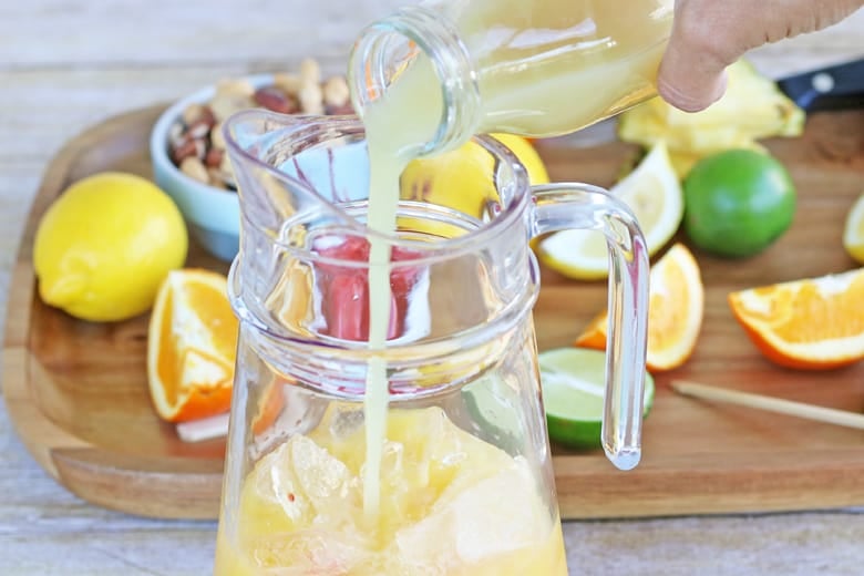 Fruit punch pouring into a pitcher 