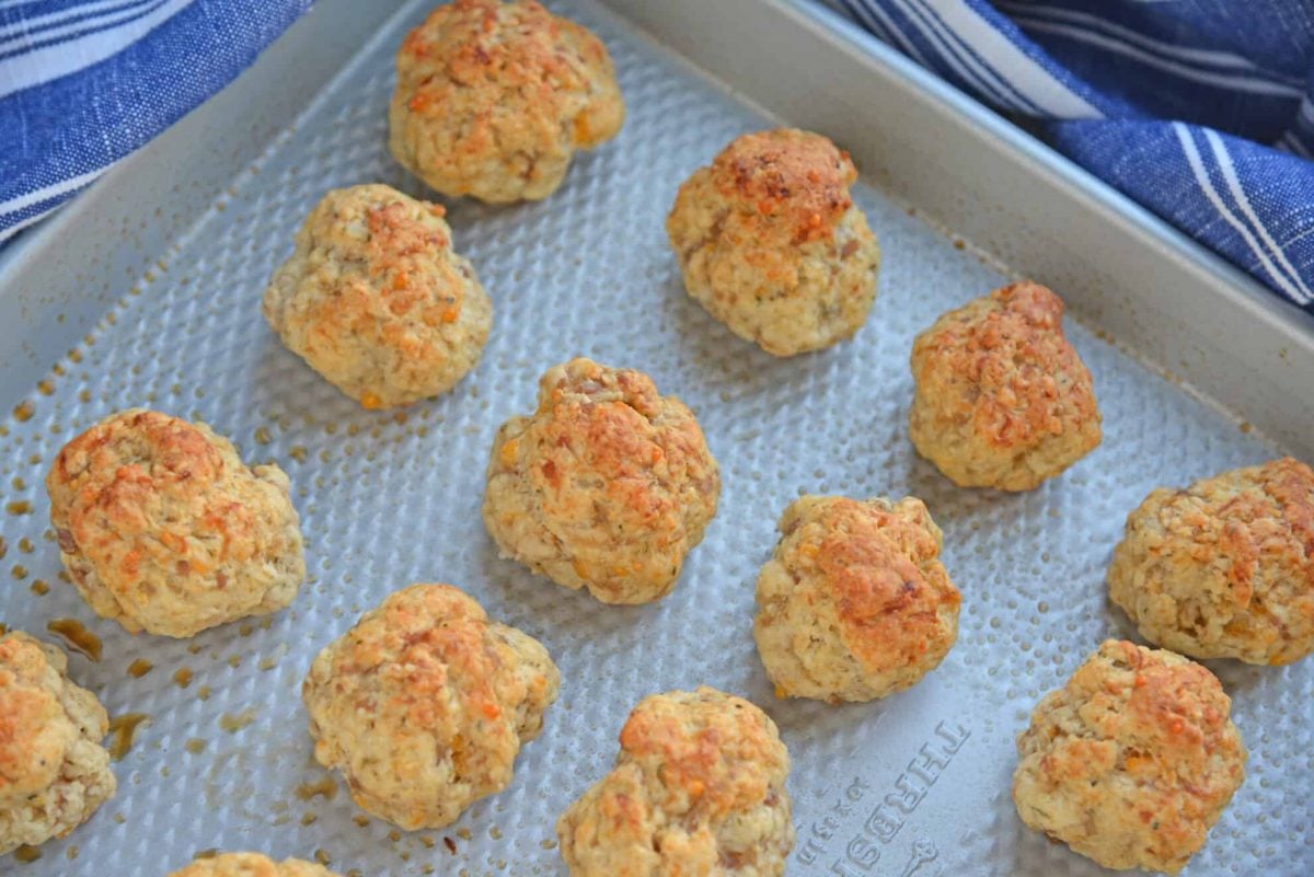 Cooked cream cheese sausage balls on a baking sheet 