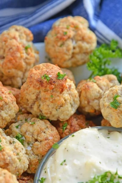 plate of sausage balls with dipping sauce