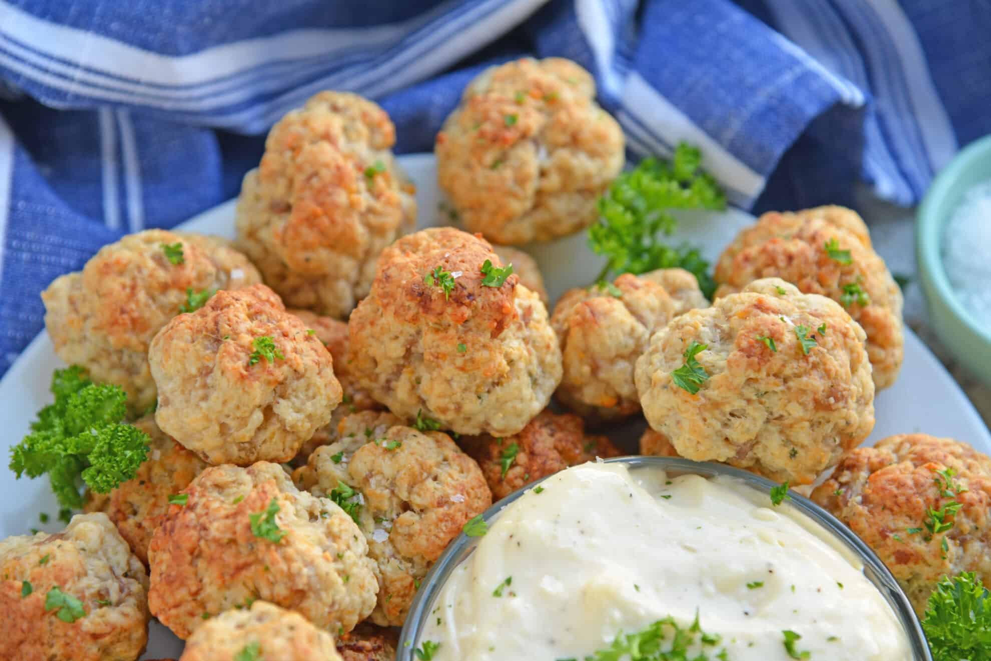 plate of sausage balls with dipping sauce