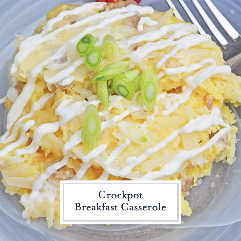 Close up of crockpot breakfast casserole with sour cream drizzle and scallions