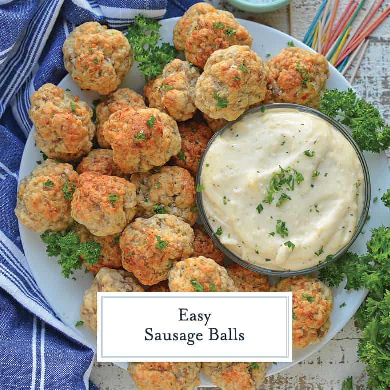 Easy Sausage Balls on a white serving dish with garlic aioli dipping sauce