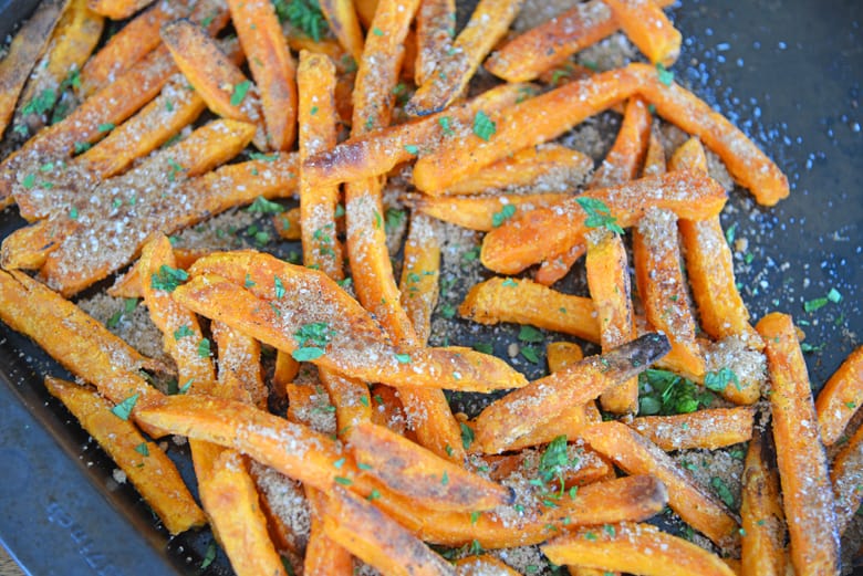 Overhead view of baked sweet potato fries with brown sugar cinnamon topping 