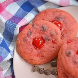 cherry chocolate chip cookies on a pink plate