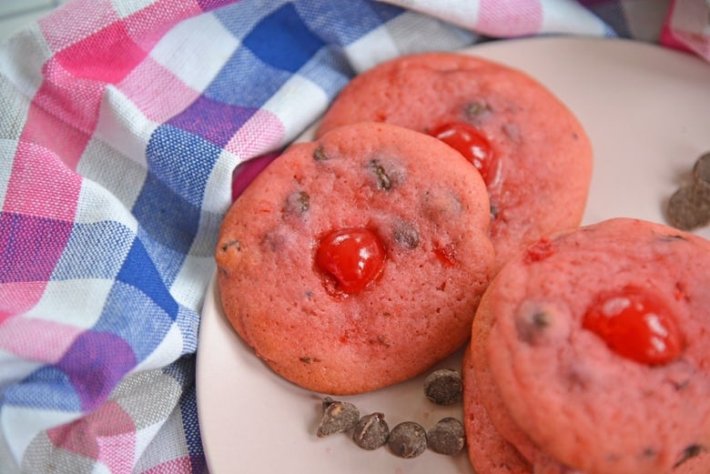 cherry chocolate chip cookies on a pink plate