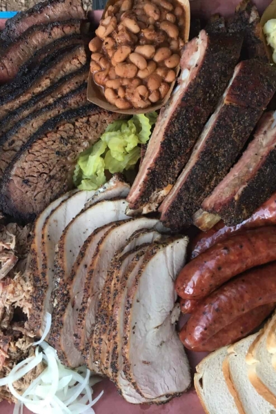 A pile of food on a plate, with Barbecue