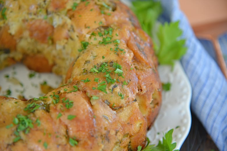 Close up of herb stuffing in a bundt pan basted with butter 