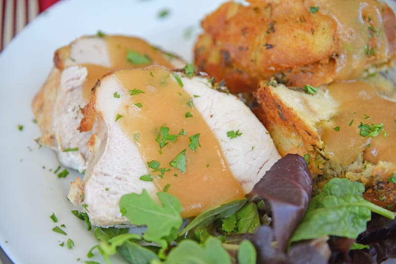 Overhead shot of sliced turkey breast with gravy 