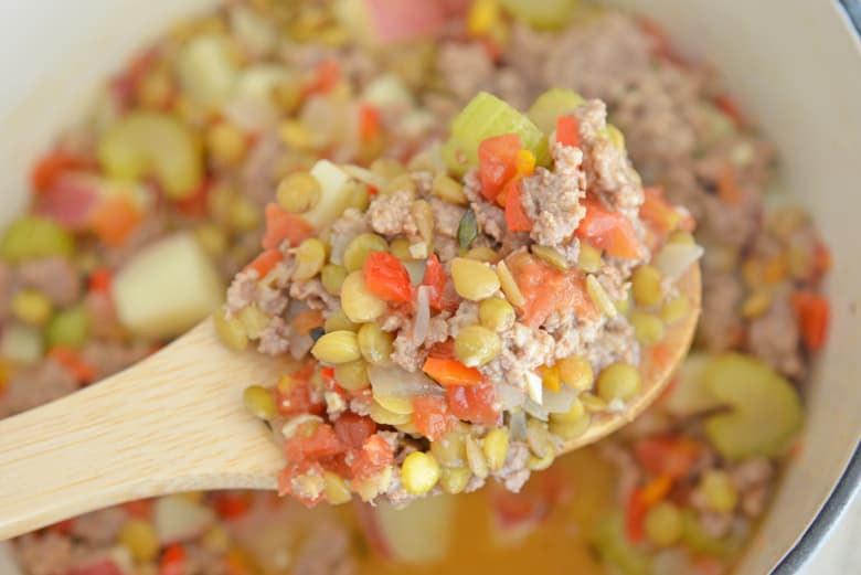 Lamb Stew on a large wooden spoon 