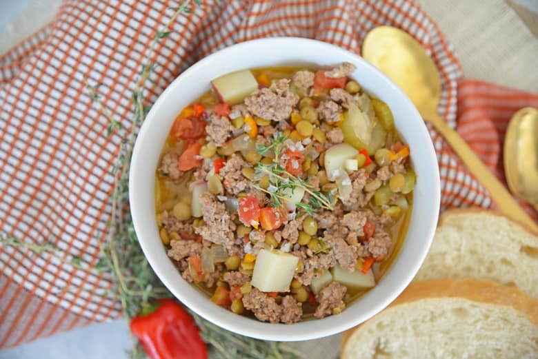 Overhead of lamb stew in a white bowl 