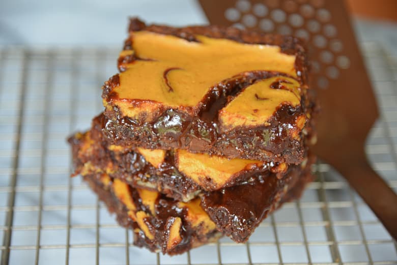 stack of pumpkin cheesecake brownies 