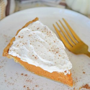 slice of frosted pumpkin pie