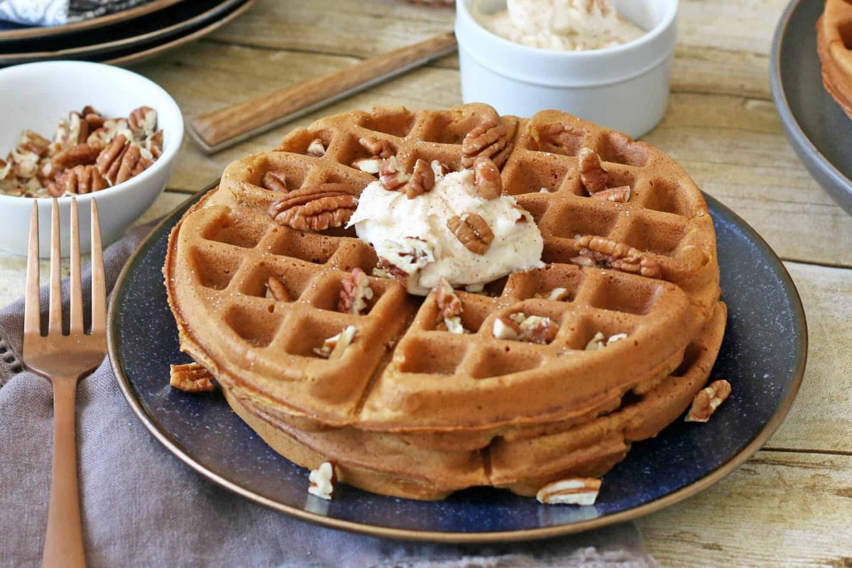 Close up of pumpkin waffles on a blue plate 