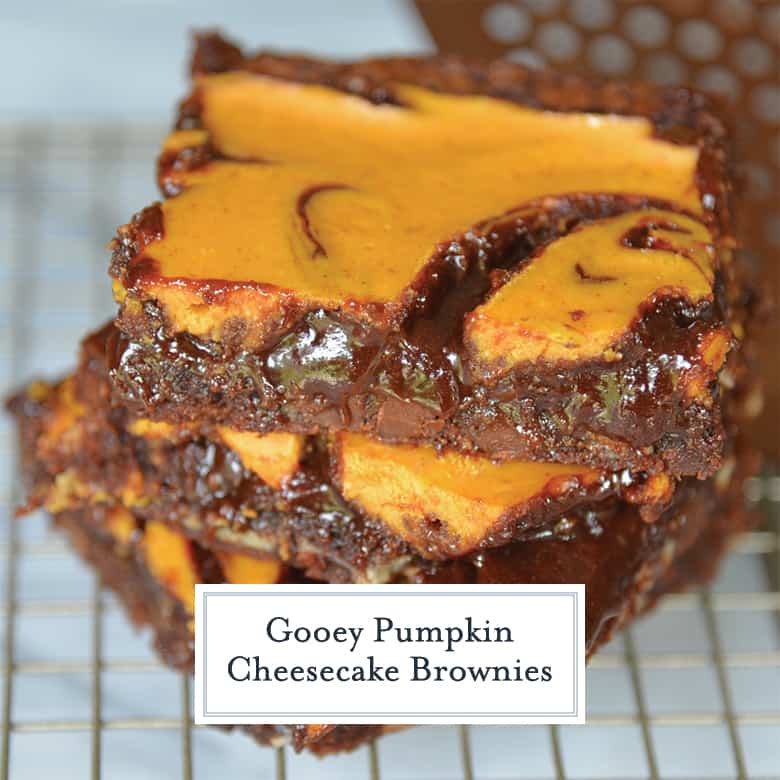 Stacked pumpkin cheesecake brownies with a gooey center 