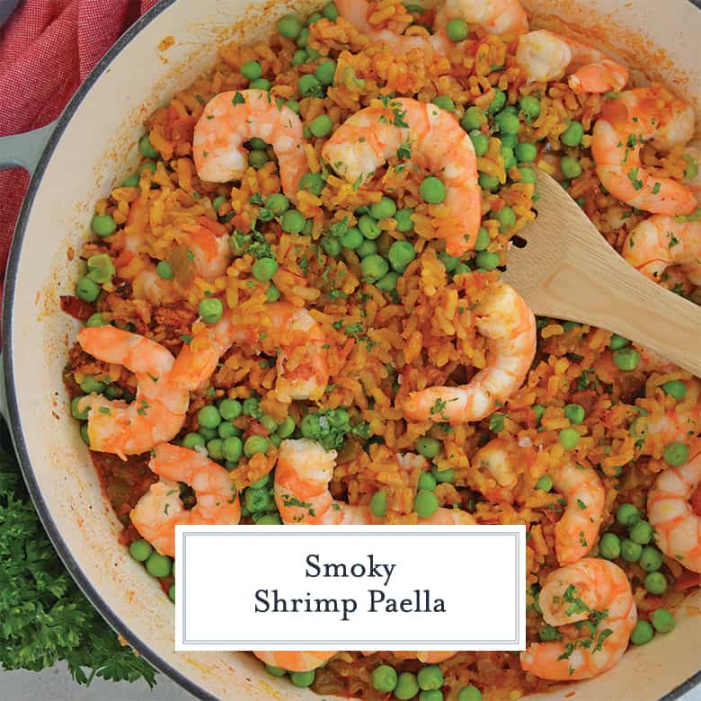 Close up of shrimp paella in a enameled skillet 