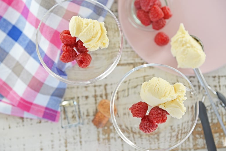 Vanilla ice cream and raspberries in cocktail glasses