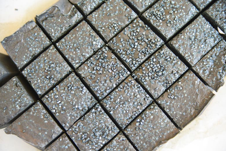 Black fudge with sprinkles cut into squares 