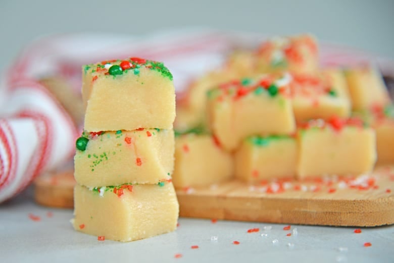 Stack of almond fudge next to a stack 