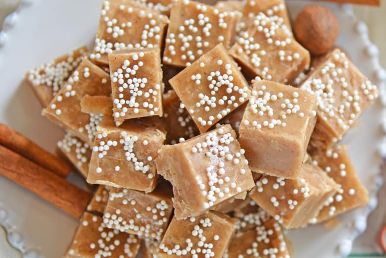 Lots of gingerbread fudge squares on a white dish 