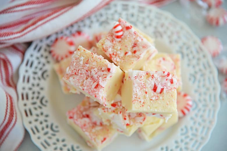 Overhead of peppermint fudge with red linens. 