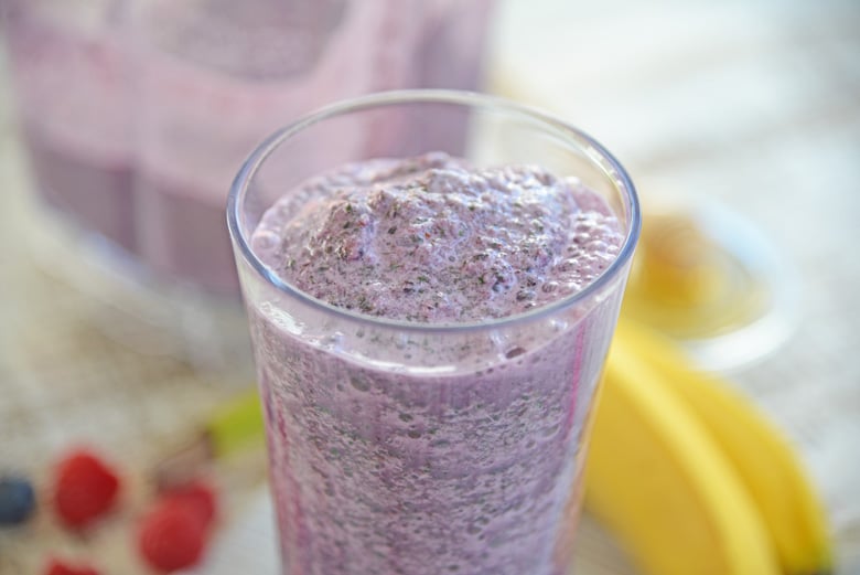 Angle of purple smoothie in a glass 